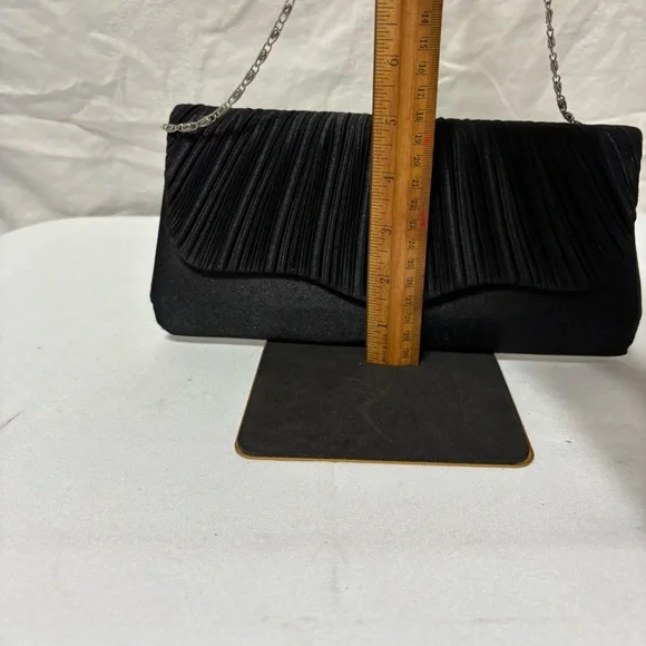 black pleated evening clutch bag with a detachable silver-tone chain strap. - Picture 5 of 5
